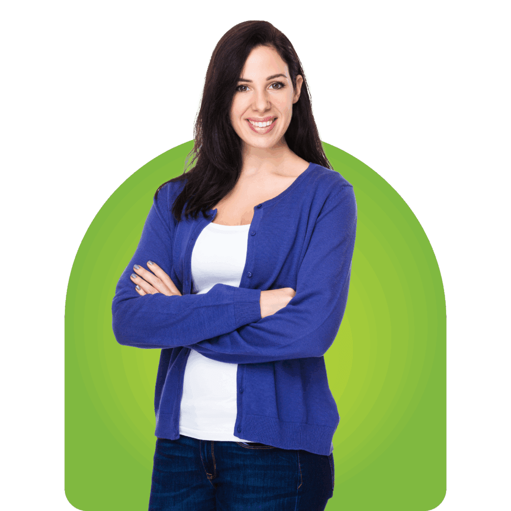 Confident woman in blue sweater smiling with arms crossed